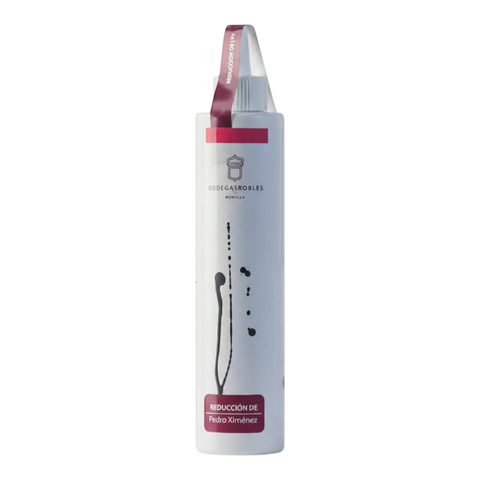 Les Grappes Piedra Luenga Pedro Ximénez reduction sauce in a white bottle with a burgundy label.